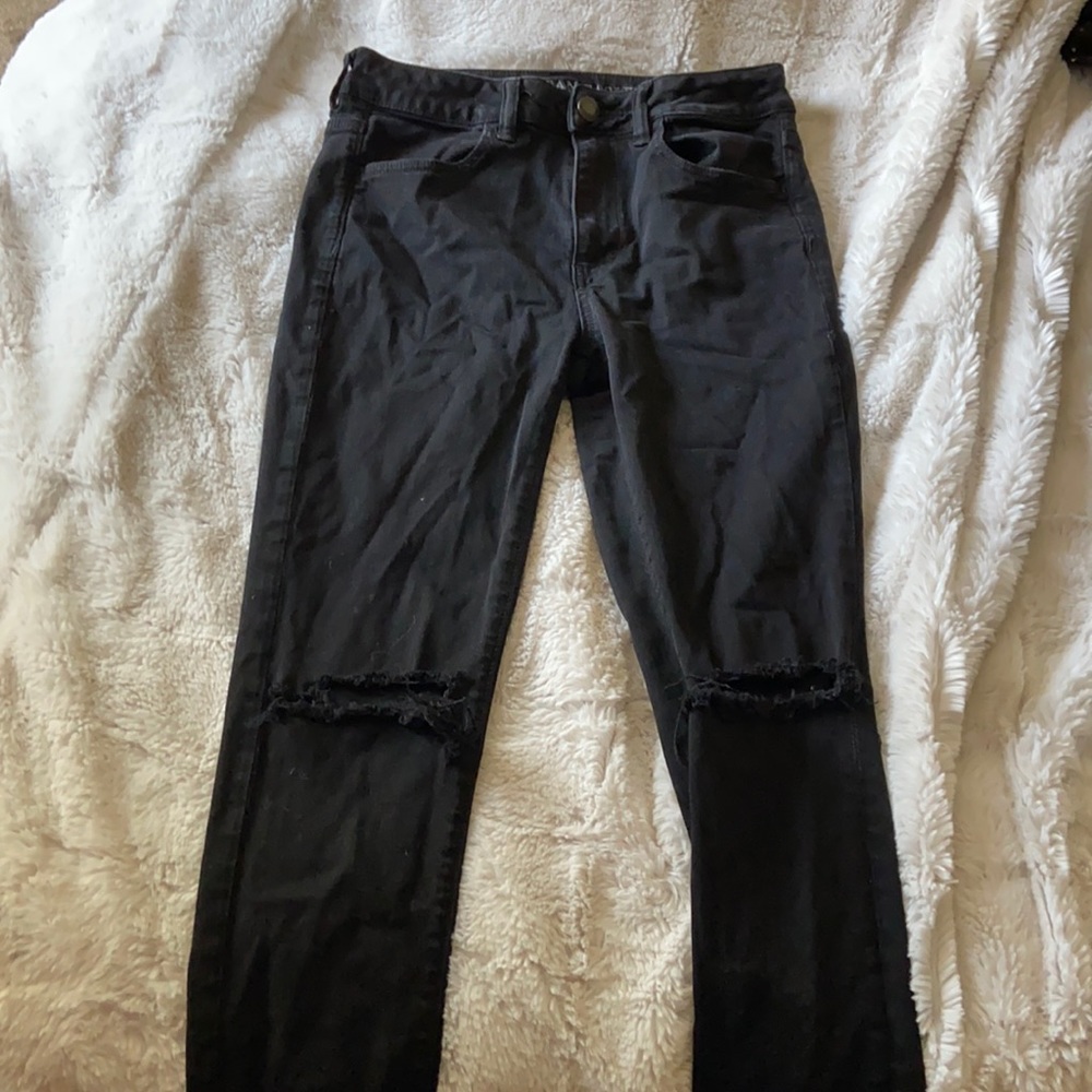 black american eagle ripped at the knees